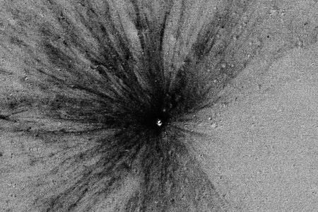 This new 39-foot-diameter impact crater formed sometime between October 25, 2012 and April 21, 2013. 