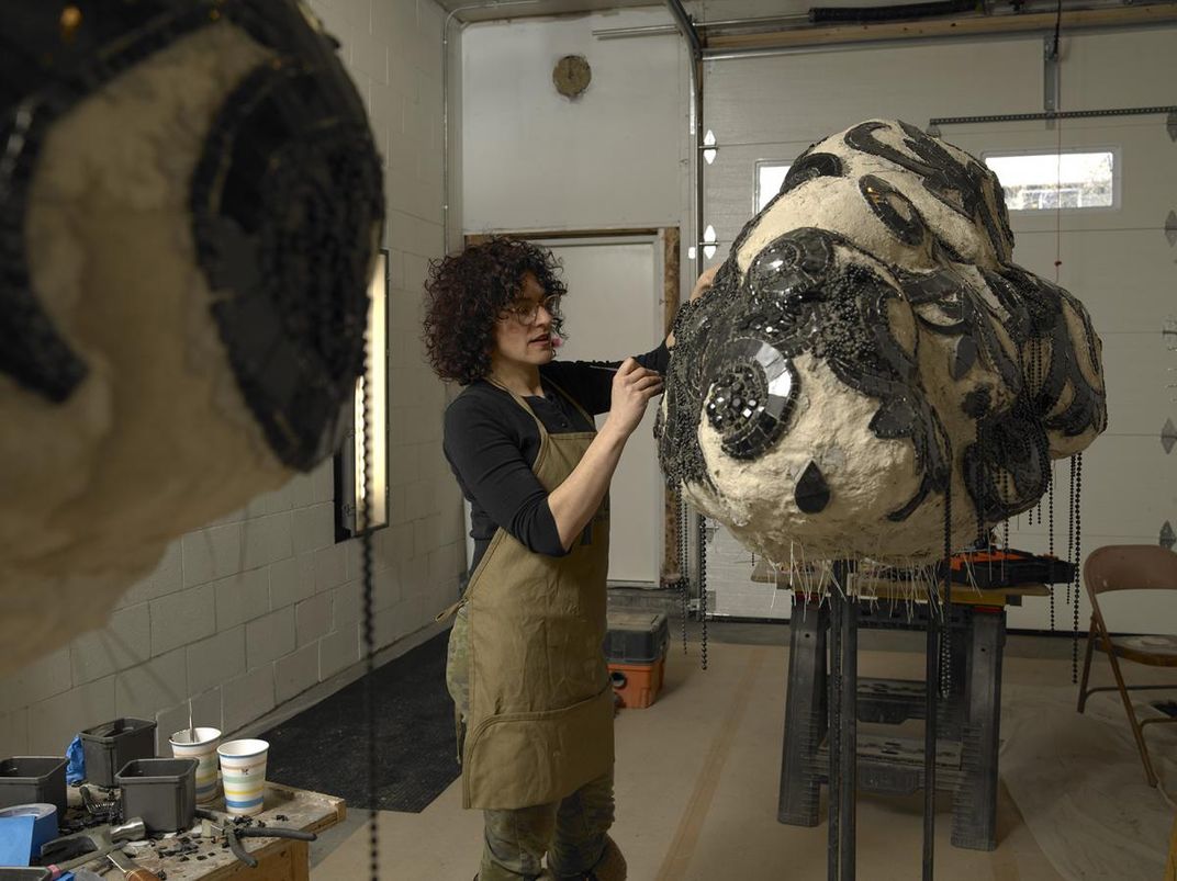 An artist working in her studio