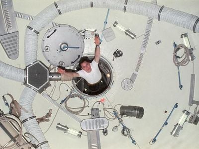 Edward G. Gibson, science pilot for Skylab 4, demonstrates zero-gravity as he floats through the airlock module hatch. About astronauts’ life in space, Raymond Loewy wrote, “Whether their experience will be one to which they wish to return, rich and rewarding, or a ghastly stretch in some cosmic Devil’s Island, is, in a large way, up to us all.” 