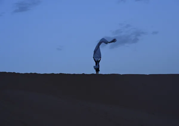 Guide at top of sand dune in Sahara Desert. thumbnail