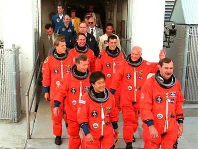 Glenn and his shuttle crewmates preparing to board Discovery in 1998.