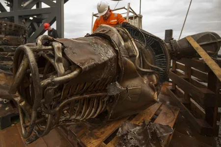 Workers clean the salvaged F-1 engine