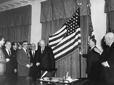 President Dwight D. Eisenhower enthusiastically declares Alaska statehood on January 3, 1959.