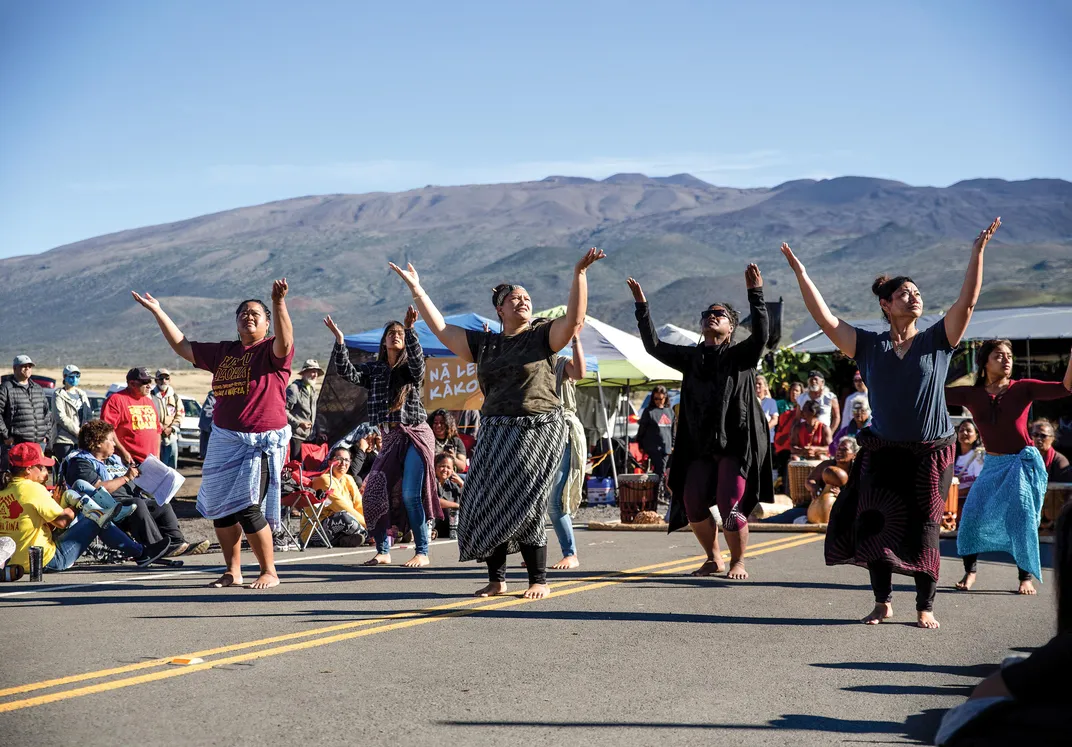 Hawaiians perform a traditional dance near Mauna Kea