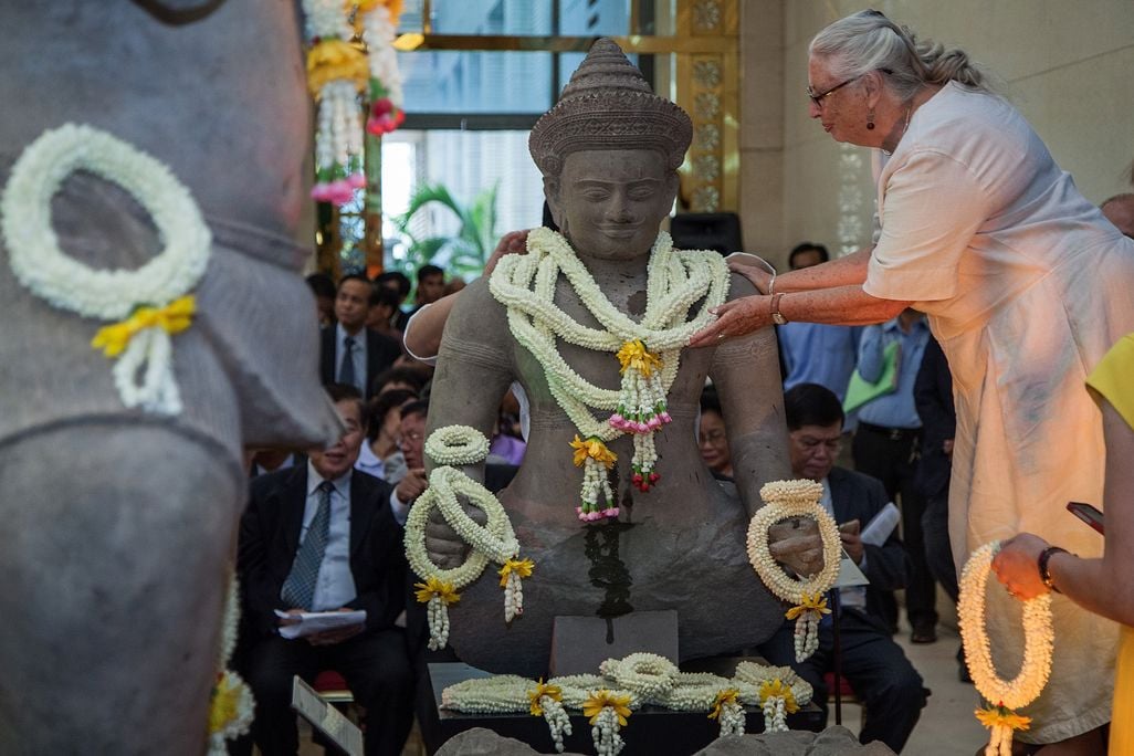 A large statue adorned with flower necklaces
