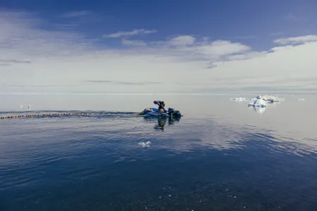 Mark Barton and principal investigator Kevin Boswell of Florida International University conduct species sampling of the nearshore waters.