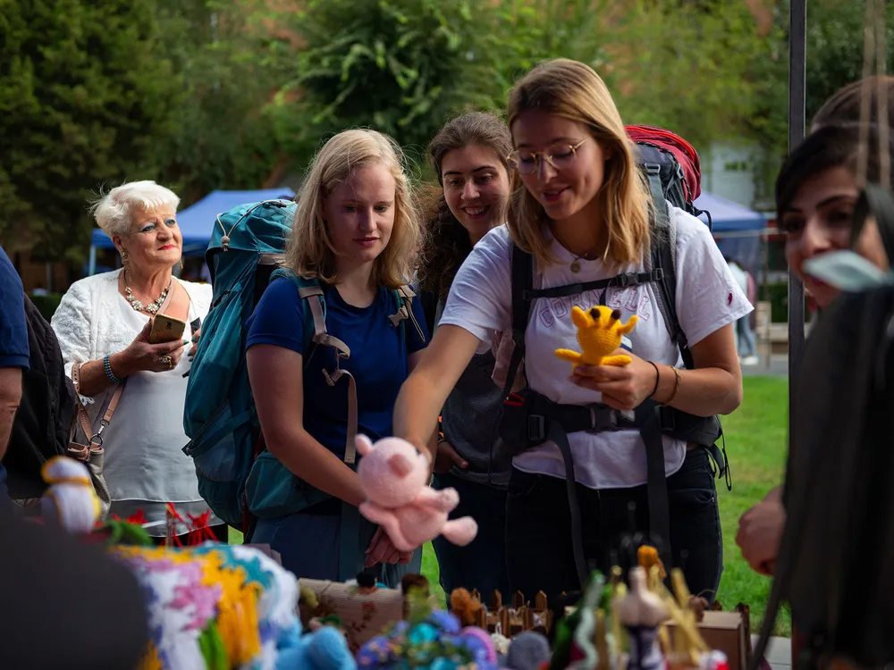 Visitors pick out crochet toys to purchase at the My Handmade Armenia Festival.