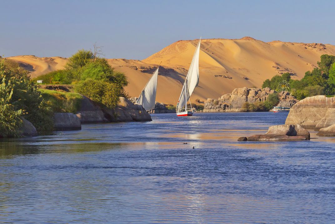 Feluccas sail the Nile near Aswan