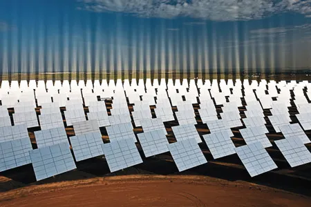 The Solúcar facility's acres of heliostats, or mirrors, focus the sun's rays to create temperatures of 570 degrees, generating energy but not harmful emissions.