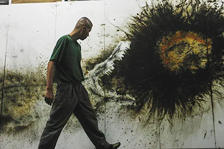 Cai Guo-Qiang reviews one of his gunpowder drawings at the Grucci fireworks plant.