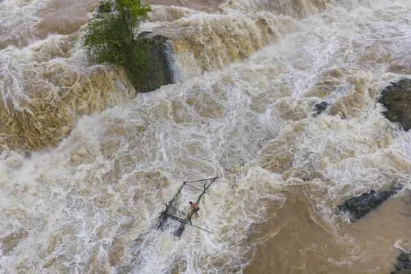 Fisherman by Waterfall thumbnail