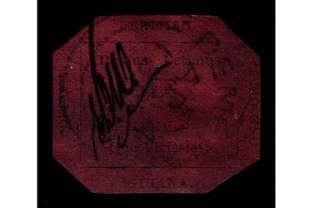 The 1856 British Guiana One-Cent Magenta, with its three-masted sailing ship, carries the postal clerk Edmond D. Wight's initials to deter counterfeiters.