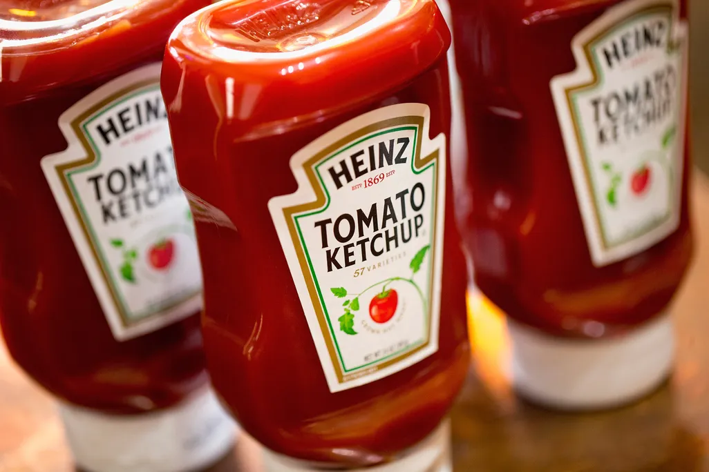 three plastic bottles of Heinz tomato ketchup