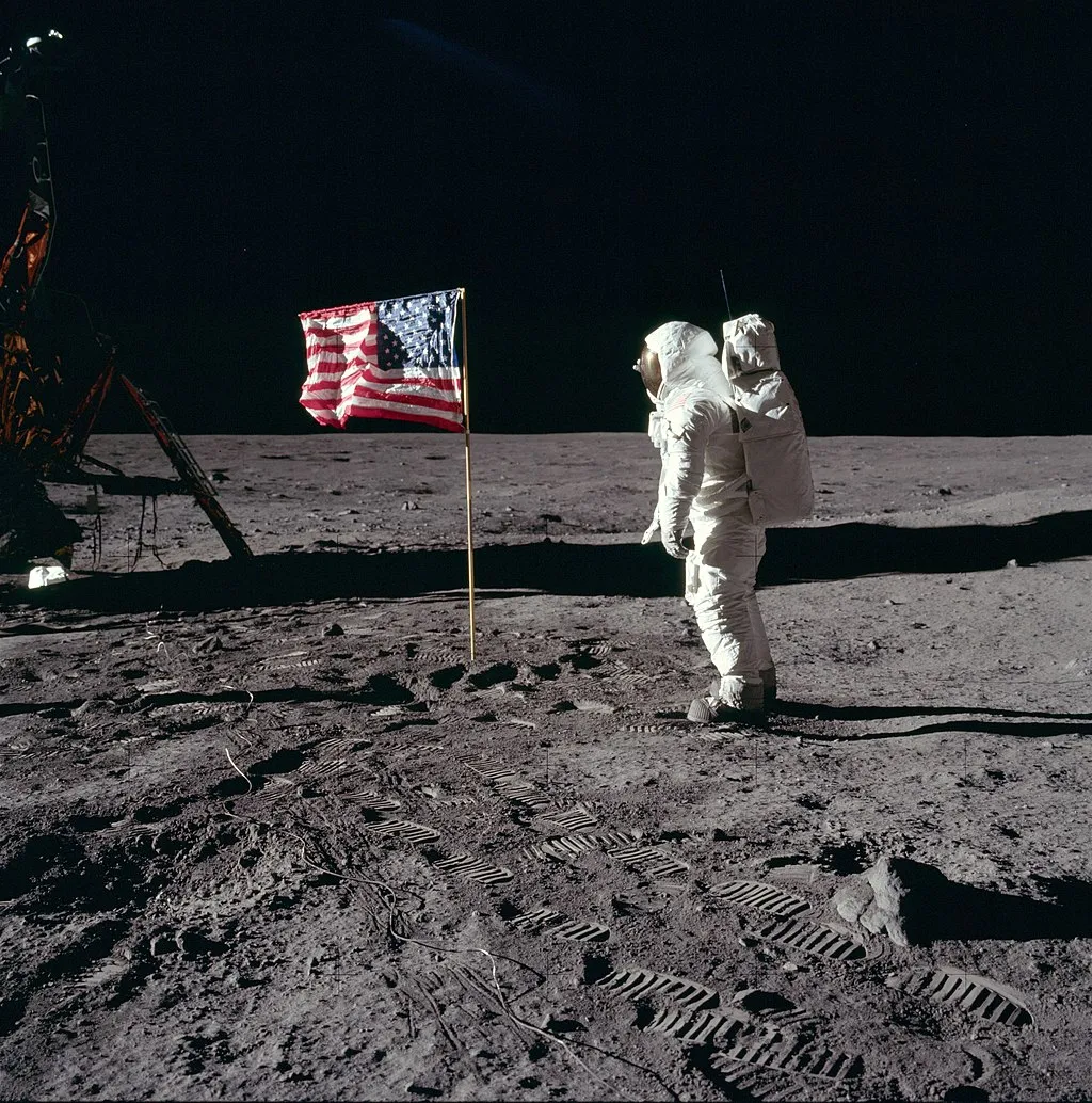 Buzz Aldrin salutes the deployed United States flag on the lunar surface.