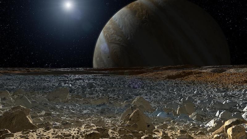 Surface of Europa with Jupiter in background