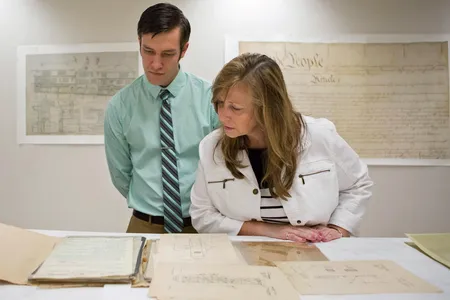 Janette Davis and her son Keith Yoerg inspect their famous relatives’ patent documents. 