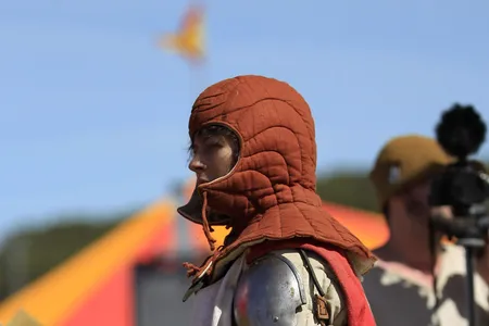 A female German fighter rests after competing in the first World International Medieval Combat Championship.