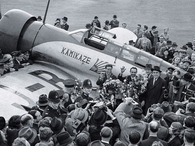 crowd surrounding Japanese airmen