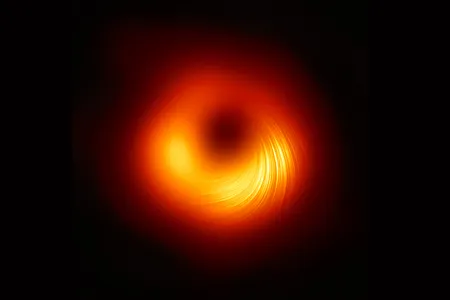 A new image of the black hole at the center of the M87 galaxy. The image shows patterns of polarized light around the supermassive black hole, which in turn reveals the structure of the black hole’s magnetic fields. 
