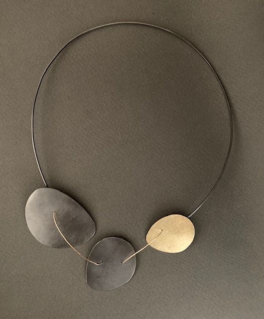 A necklace by Reiko Ishiyama is made of oxidized sterling silver
