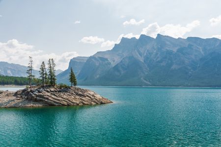 Beneath the surface of Lake Minnewanka, located in Alberta, Canada, rests the remains of a former resort town. 