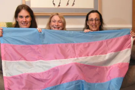 Transgender flag designed by Monica Helms (right), and friends. The flag's stripes represent the traditional pink and blue associated with girls and boys and white for intersex, transitioning, or of undefined gender. Helms served in the United States Navy and became an activist for transgender rights in the late 1990s in Arizona where she grew up. She designed the flag in 1999.