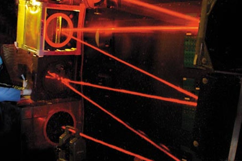 An engineer adjusts the beam-control optics that ride in the nose of the Airborne Laser Testbed, a modified Boeing 747-400F. The optics stabilize and shape the weapon laser’s beam as it is aimed by the nose turret’s computer-controlled telescope at a targ