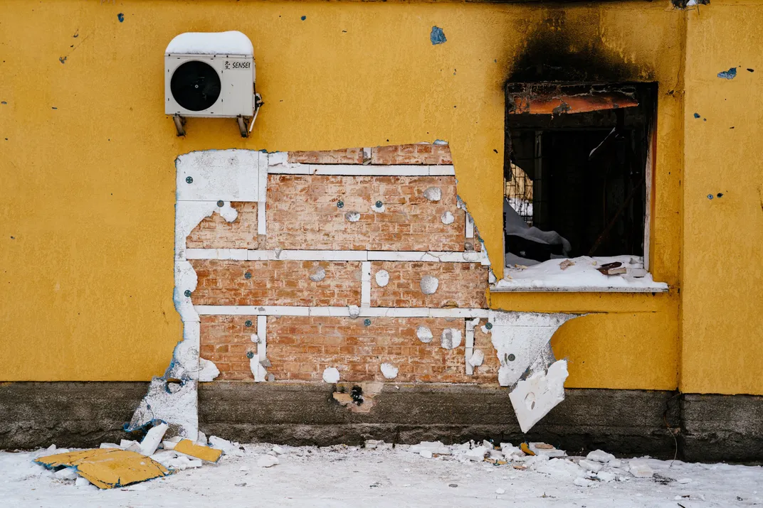 A cut off of the wall of the damaged building