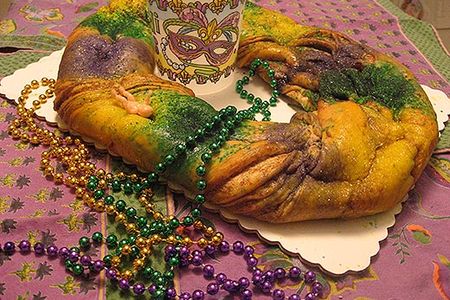 Robért Fresh Market’s cake came with Mardi Gras beads, and a Mardi Gras plastic cup, but much to our disappointment, the baby was nestled on the outside of the cake, so there was no suspense in consumption process. Still, we had no problem eating the entire cake. The dough was delicate and layered, and the icing not overwhelming. A delicious prospect even without the surprise.
