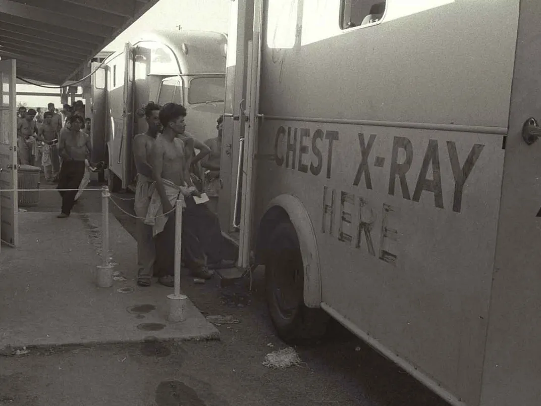 Braceros approach a chest x-ray truck to get examined