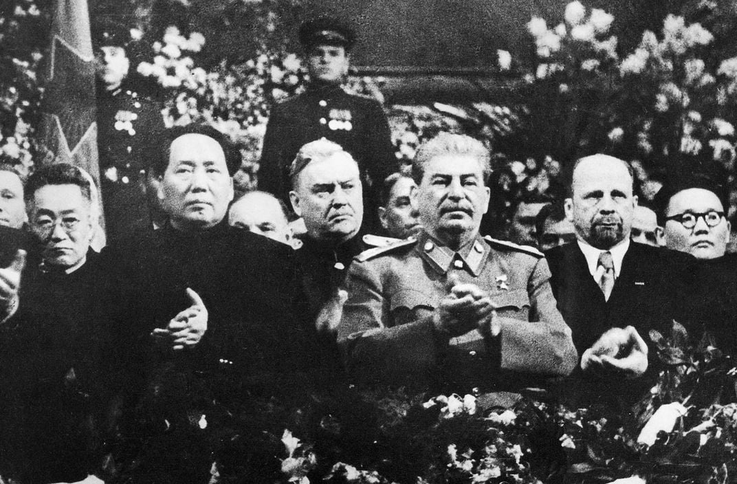 Stalin (third from right) poses on his 70th birthday alongside Chinese Communist Party leader Mao Zedong (second from left).