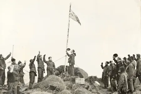 Members of the Australian National Antarctic Research Expedition raise the Australian flag over Heard Island on December 26, 1947.