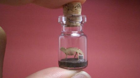 A paper "Brontosaurus" skeleton in a bottle, created by Akinobu