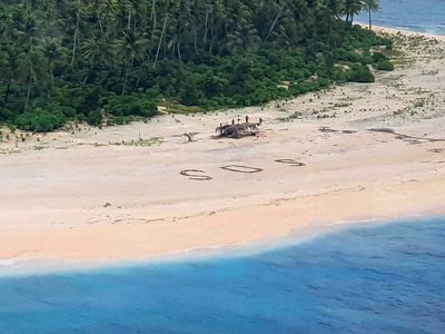 An Australian ARH Tiger attack helicopter was able to land on the beach and deliver supplies to three castaways on tiny Pikelot Island. Their S.O.S. message was spotted by the U.S. crew of a KC-135 Stratotanker.