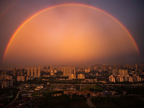 A Magnificent Full Rainbow Arching Gracefully over the Kuala Lumpur City. thumbnail
