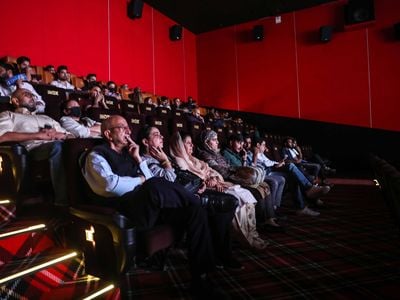 Guests watch&nbsp;Vikram Vedha&nbsp;on the opening day of&nbsp;Srinagar&#39;s multiplex cinema.