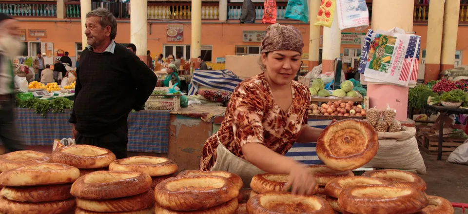  Vendor selling traditional bread at Panjshanbe Bazaar, Khujand, Tajikistan 