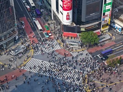 Crowds make their way through the Shibuya District in Tokyo, home to a key railway station and one of its busiest neighborhoods.