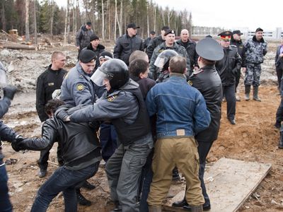 Police detain activists who are trying to protect forests from the construction of a Moscow-St. Petersburg highway in April 2011.