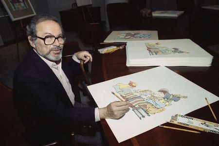 Maurice Sendak signing prints from "The Mother Goose Collection" in 1990.