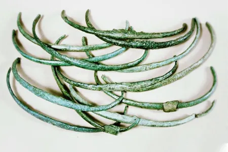 Similar in weight and appearance, these Bronze Age ribs, or curved rods, may have been used as an early form of money.