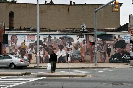 The "Faces of Dudley" mural depicts residents of Boston's Roxbury neighborhood
