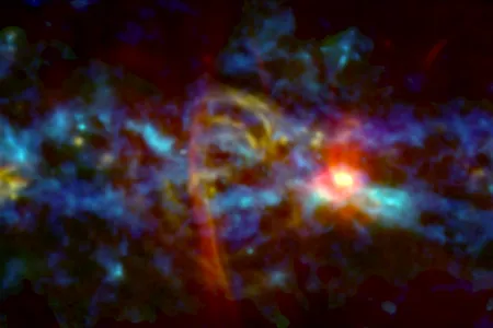 An image of the center of the Milky Way galaxy, where a red and yellow "candy cane" feature was recently observed by astronomers