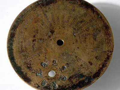 The back of an ancient sundial reveals a cheat sheet of locations and latitude coordinates.