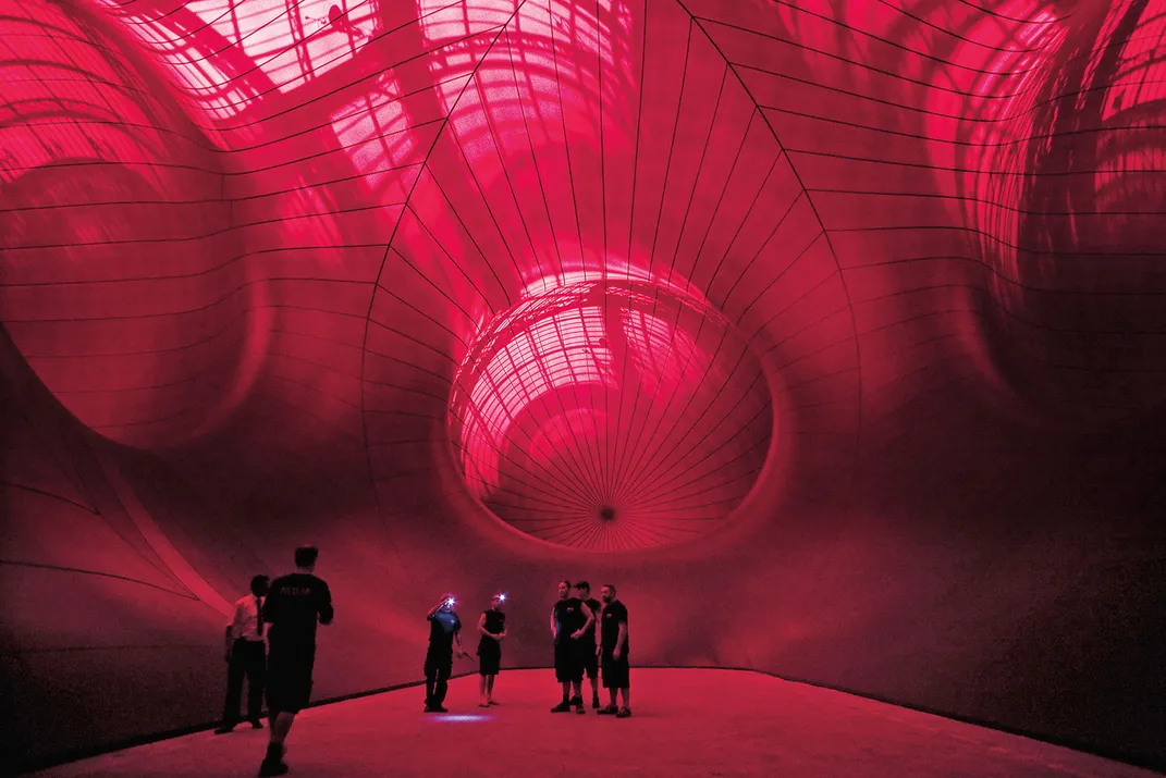 Visitors step inside Leviathan, a giant inflated structure at the Grand Palais in Paris.