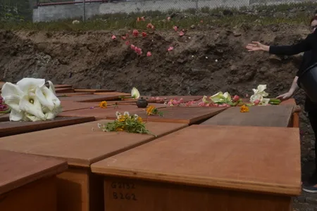 The exumed remains were reburied in caskets in 2022.