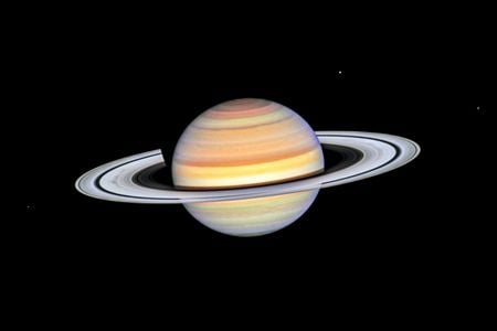 A photo of Saturn taken by the Hubble Telescope last October. Small dark marks called ring spokes are visible on the planet&#39;s left side, just inside the widest black band of space between rings.