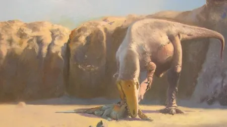 In this restoration by Emiliano Troco, a Sauroniops feeds on a juvenile Spinosaurus. (And yes, all the dinosaurs in this image are fluffy.)