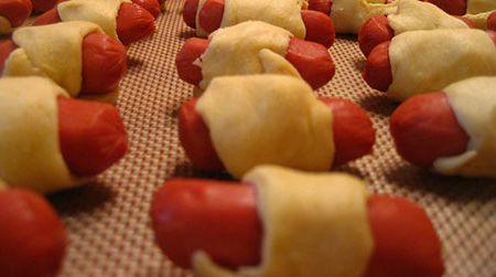 Making pigs in a blanket was a "true test of patience and stealth" for the author.