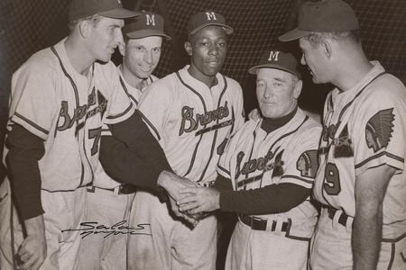 Hank Aaron (center) poses with his teammates in this 1956 photograph by Osvaldo Salas.